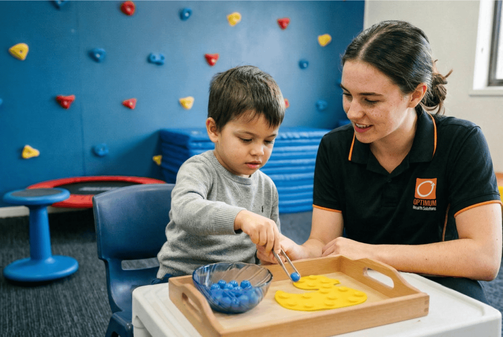 An occupational therapist guides her paediatric client, who is on the NDIS, through the process of marble transfer, a task designed to improve fine motor skills. This only one representation of Occupational Therapy, a broad disciplines that helps people with everyday tasks and development designed for life improvement.